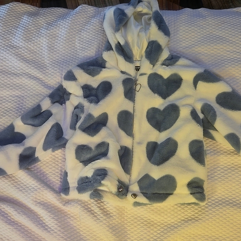 White jacket with blue hearts
